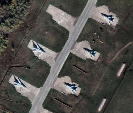 A KH-9 Hexagon film frame of an airfield with parked aircraft